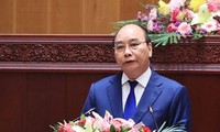 Chủ tịch nước Nguyễn Xuân Phúc phát biểu tại Kỳ họp lần thứ nhất, Quốc hội Lào khóa IX. (Ảnh: Thống Nhất/TTXVN) 