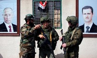 Binh sĩ Nga và Syria ở Damascus. Ảnh: Reuters