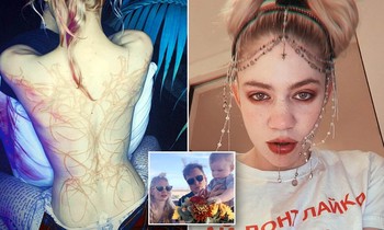 Bạn gái tỷ phú giàu nhất thế giới Elon Musk khoe hình xăm kín lưng