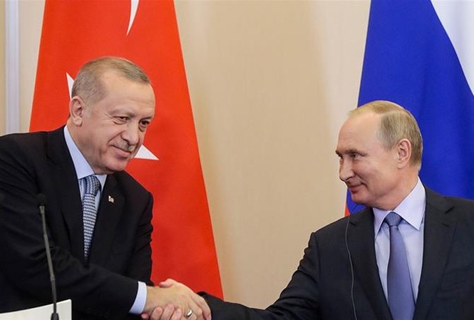 Nga - Thổ Nhĩ Kỳ 'bắt tay' gạt Mỹ khỏi ván cờ Syria Tổng thống Nga Vladimir Putin và Tổng thống Thổ Nhĩ Kỳ bắt tay sau khi đạt được thỏa thuận về Syria hôm 22/10 ảnh: AP
