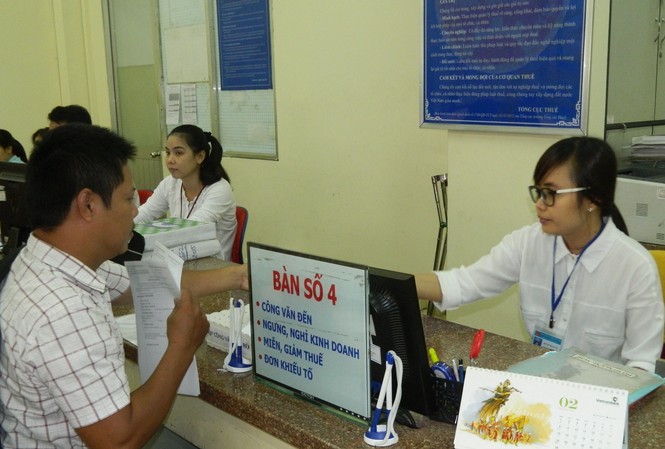 Tự kê khai, nộp thuế, doanh nghiệp dễ bị... phá sản Doanh nghiệp làm thủ tục về thuế tại Chi cục Thuế quận 1, TPHCM