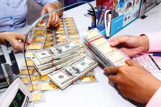 Giá vàng và USD bất ngờ tăng giá Giá vàng và USD bất ngờ tăng giá. ảnh minh hoạ