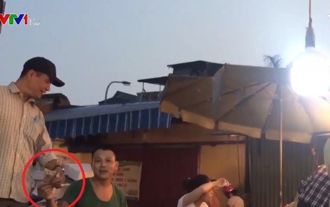 Khẩn trương điều tra hoạt động bảo kê tại chợ Long Biên ảnh 1