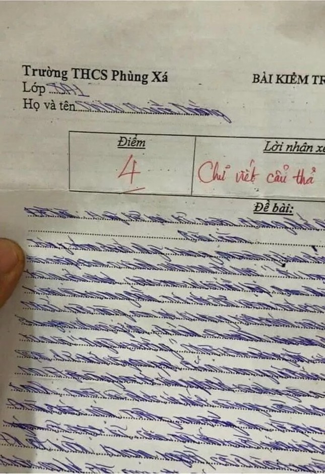 Chữ viết “đổ rạp” của nam sinh đố ai đọc được, cô giáo cho điểm cũng phải “hoa mắt“ ảnh 1