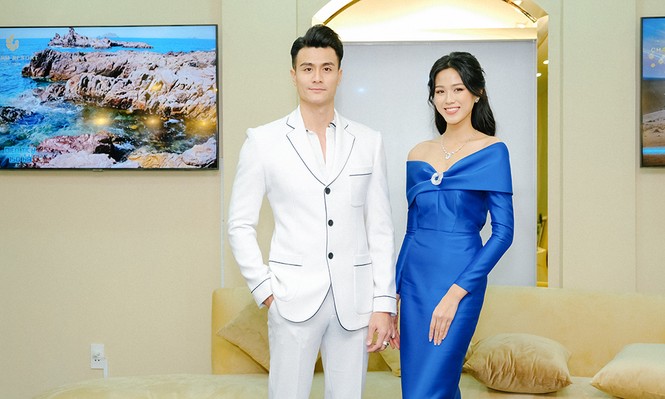 Hoa hậu Đỗ Thị Hà diện váy trễ vai nóng bỏng, khoe sắc rực rỡ bên siêu mẫu Vĩnh Thụy - ảnh 2