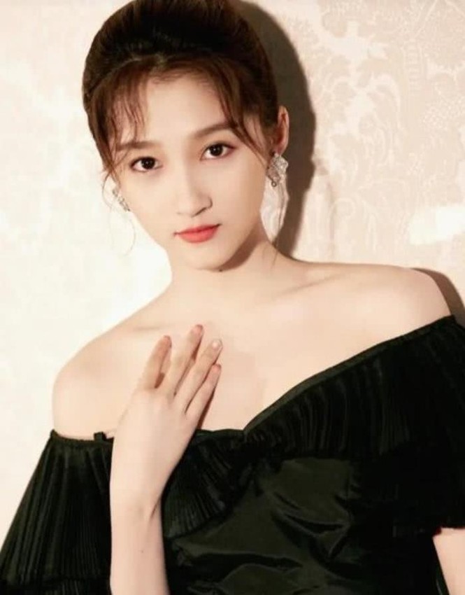 Quan Hiểu Đồng 1 bước lên
