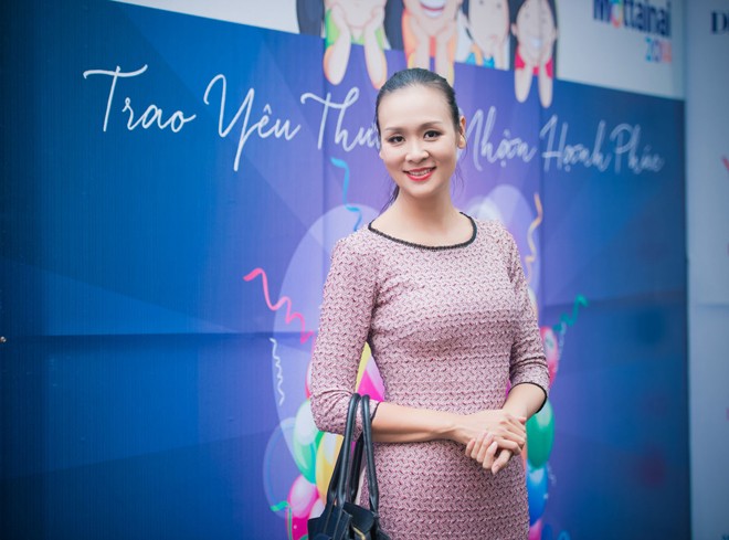Trương Tùng Lan mặc áo dài duyên dáng dự ngày hội từ thiện - ảnh 10