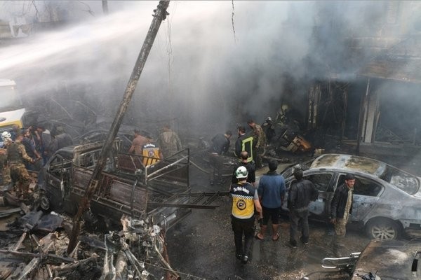 Hiện trường vụ nổ bom xe ở Syria khiến gần 100 nguời thương vong - ảnh 3