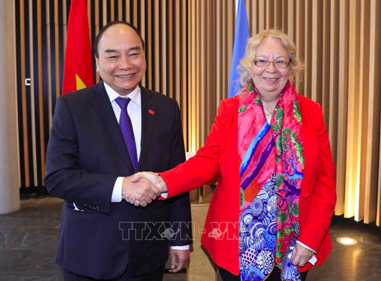 Chủ tịch nước Nguyễn Xuân Phúc gặp Tổng Giám đốc Văn phòng LHQ Tatiana Valoya. (Ảnh: TTXVN)