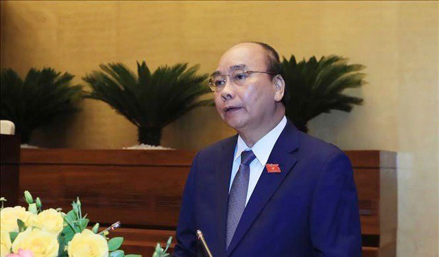 Thủ tướng Nguyễn Xuân Phúc báo cáo về tình hình kinh tế, xã hội tại phiên khai mạc kỳ họp Quốc hội (ảnh Nhật Minh)
