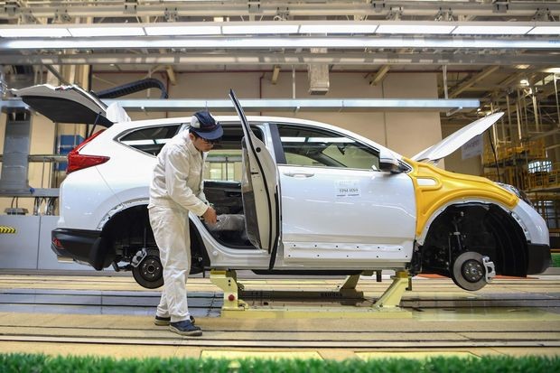 Nhiều nhà máy ôtô tại Trung Quốc cho nhân viên nghỉ Tết dài ngày hơn. Ảnh: Wall Street Journal