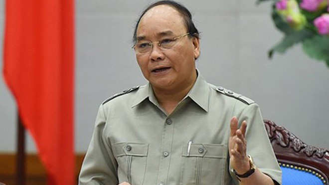Thủ tướng Nguyễn Xuân Phúc chỉ đạo tập trung lực lượng, tìm bằng được phi công máy bay Su-30 MK2 mất tích là thượng tá Trần Quang Khải. Ảnh: VGP.