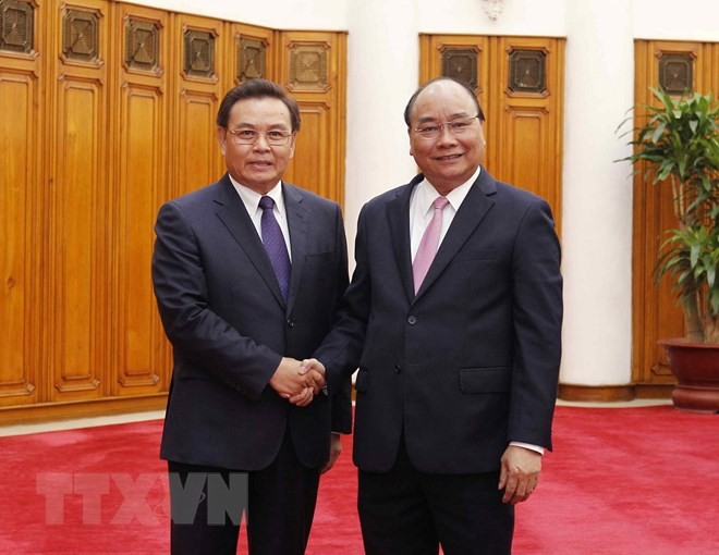 Thủ tướng: Không để các thế lực thù địch chia rẽ quan hệ Việt-Lào